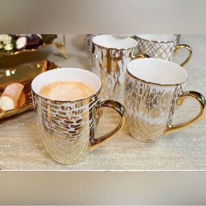Certified International
4 Piece gold  Multi-Colored Porcelain 16 oz. Mug Set